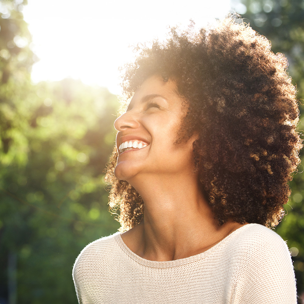 A happy woman after receiving depression therapy treatment.