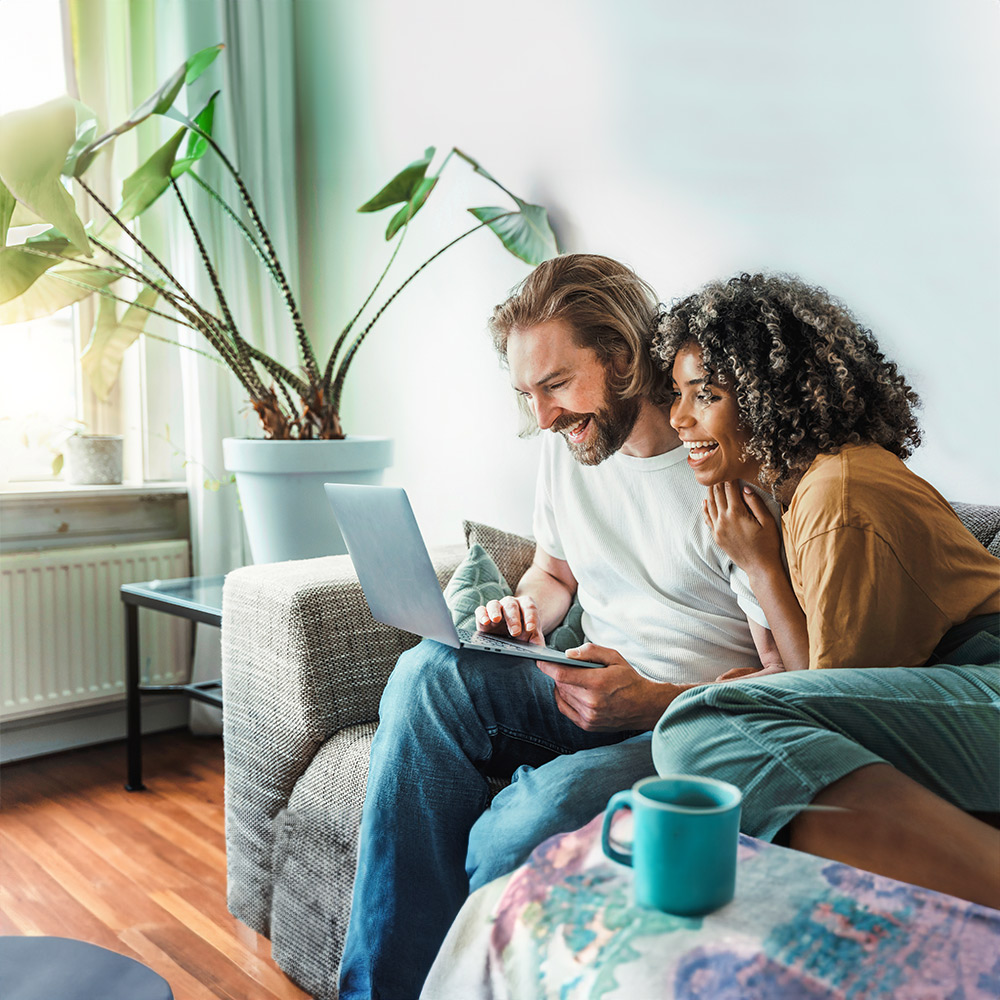 Happy couple receiving online counseling from a virtual Therapist.