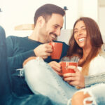 Cheerful young couple in the morning at home.